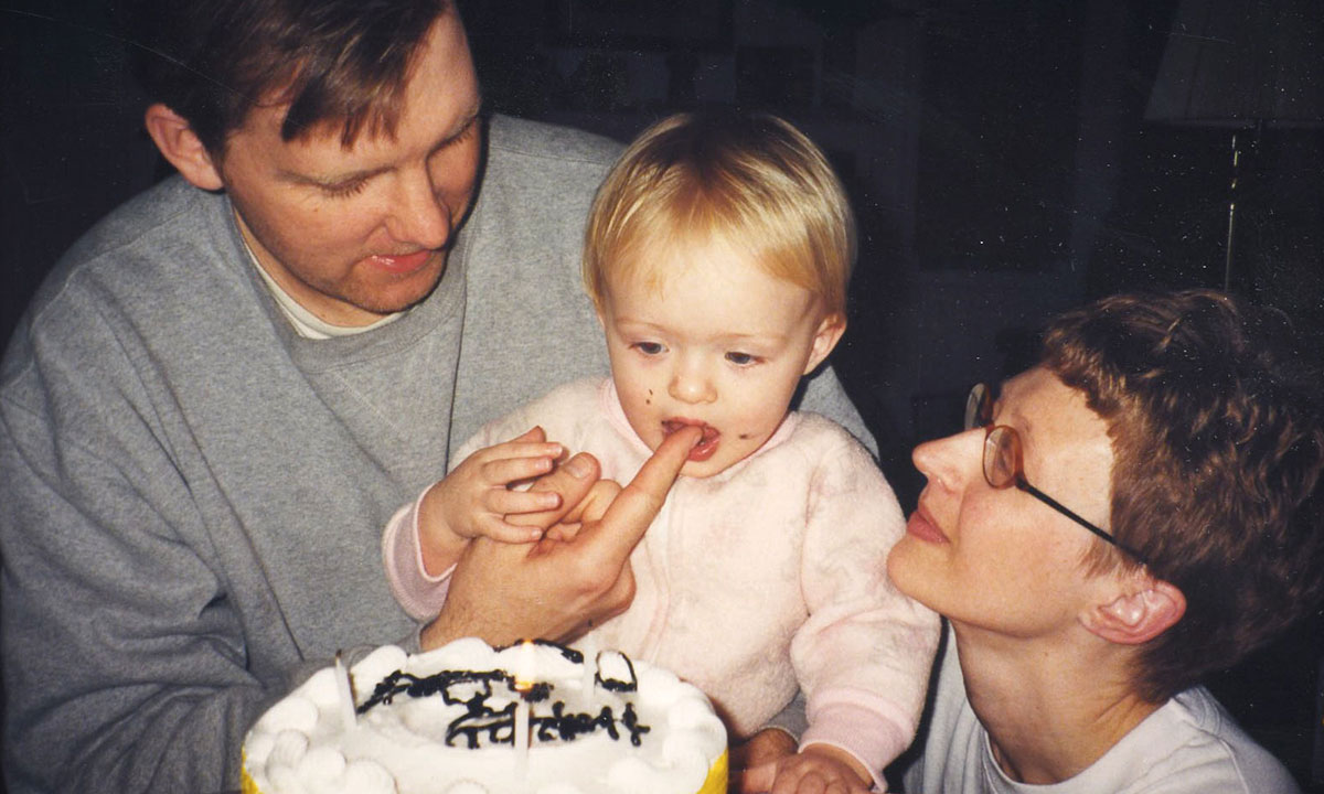 young family celebrating toddlers birthday