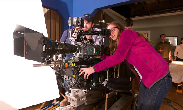 students using a camera filming a scene