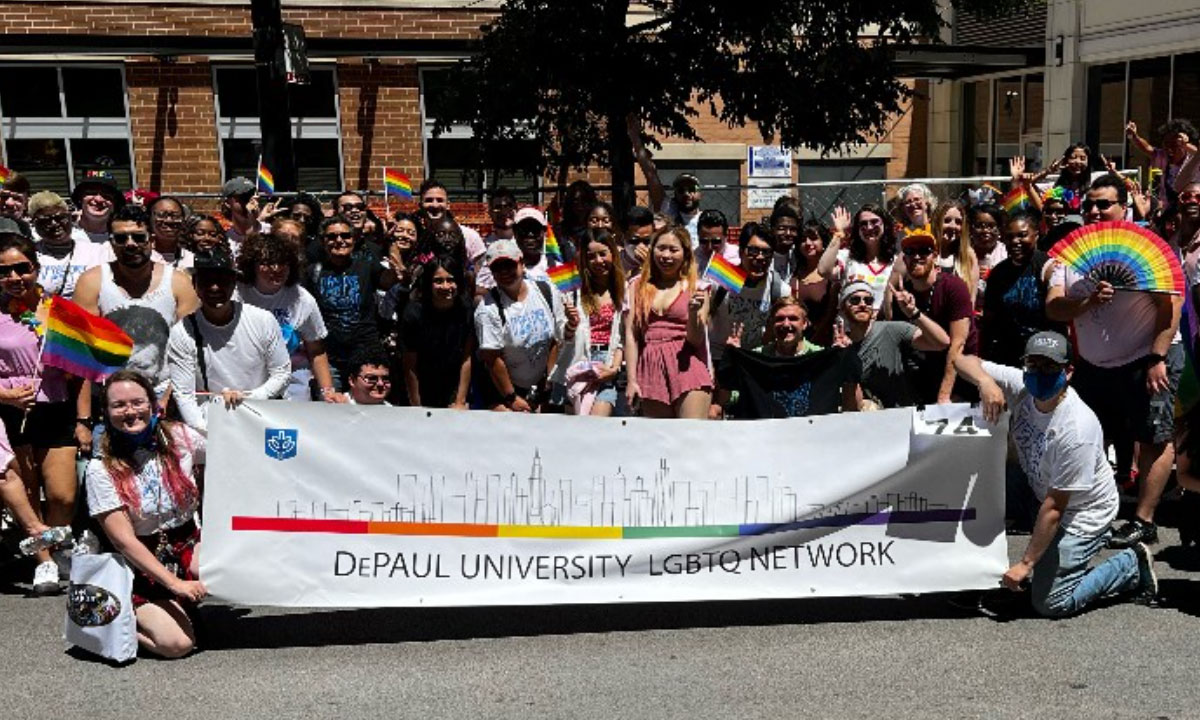 large student group pic with DePaul University L G B T Q Newtwork banner