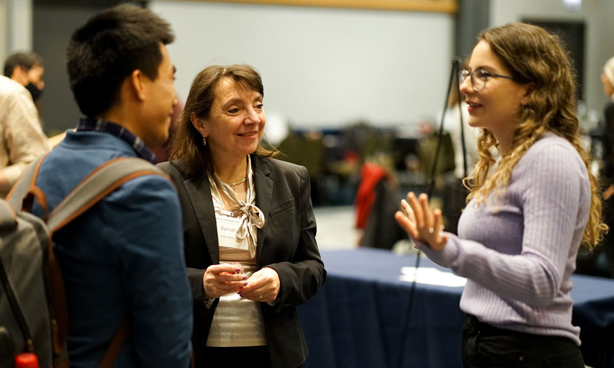students talking to a teacher