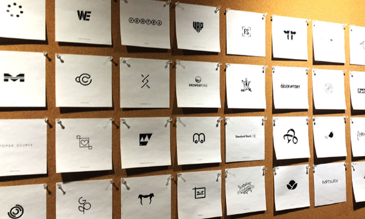 many logo concepts on wall displayed